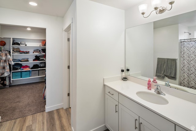 bathroom featuring hardwood / wood-style floors and vanity