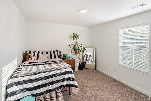 bedroom featuring carpet