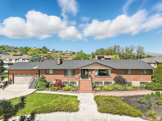 208 S 1100 E, Payson, UT 84651 - view of front of house with stairway, a garage, driveway, a chimney, and a residential view