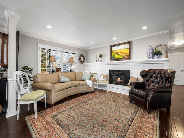 208 S 1100 E, Payson, UT 84651 - living room featuring crown molding, dark wood-style floors, a brick fireplace, and recessed lighting