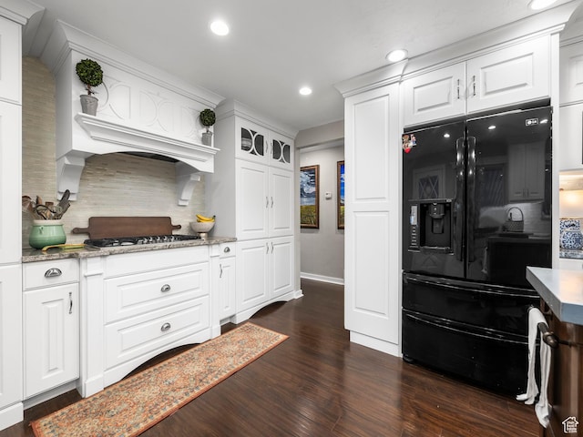 208 S 1100 E, Payson, UT 84651 - kitchen with black refrigerator with ice dispenser, stainless steel gas cooktop, tasteful backsplash, dark wood finished floors, and white cabinetry