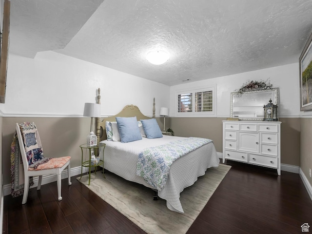 208 S 1100 E, Payson, UT 84651 - bedroom featuring dark wood finished floors and a textured ceiling