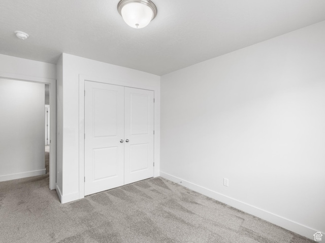 364 S 1580 E, Hyrum, UT 84319 - unfurnished bedroom featuring light carpet and a closet