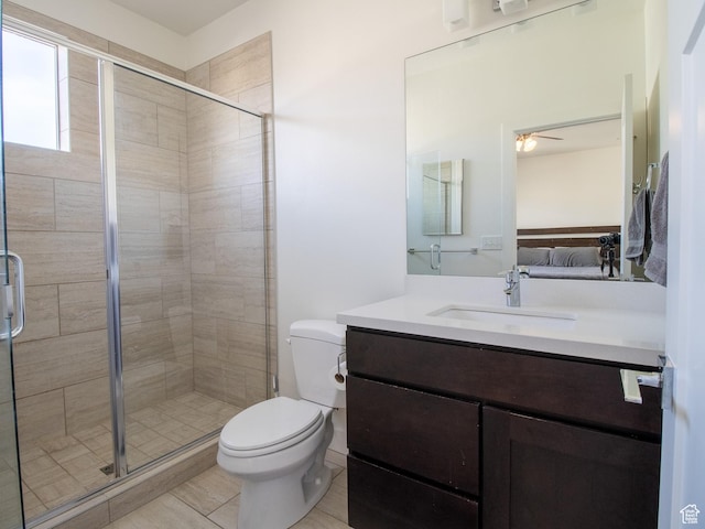 1418 E Komenda Way, Millcreek, UT 84124 - bathroom featuring vanity, a shower with door, tile patterned flooring, ceiling fan, and toilet