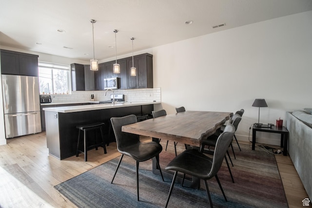 1418 E Komenda Way, Millcreek, UT 84124 - dining area featuring light hardwood / wood-style floors