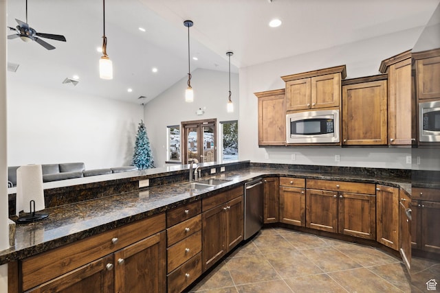 13579 N Hillclimb Ln, Kamas, UT 84036 - kitchen featuring sink, hanging light fixtures, tile patterned floors, dark stone countertops, and appliances with stainless steel finishes