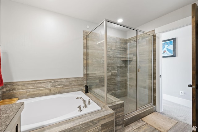 13579 N Hillclimb Ln, Kamas, UT 84036 - bathroom featuring hardwood / wood-style floors, vanity, and shower with separate bathtub