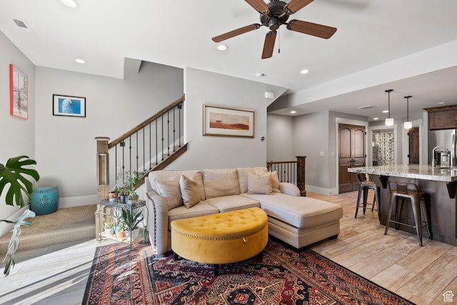 13579 N Hillclimb Ln, Kamas, UT 84036 - living room featuring ceiling fan and light wood-type flooring