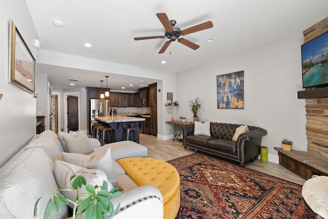 13579 N Hillclimb Ln, Kamas, UT 84036 - living room featuring ceiling fan and light hardwood / wood-style flooring