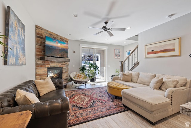 13579 N Hillclimb Ln, Kamas, UT 84036 - living room with ceiling fan, a fireplace, and light wood-type flooring