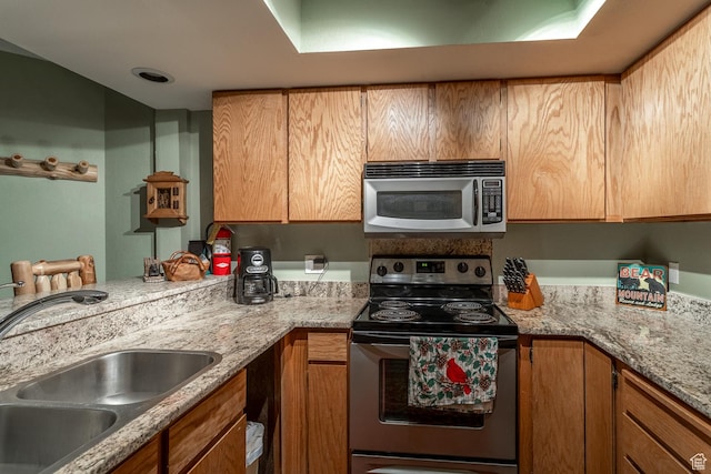 407 S Vasels Rd Unit 65, Brian Head, UT 84719 - kitchen with stainless steel appliances, light stone counters, and sink