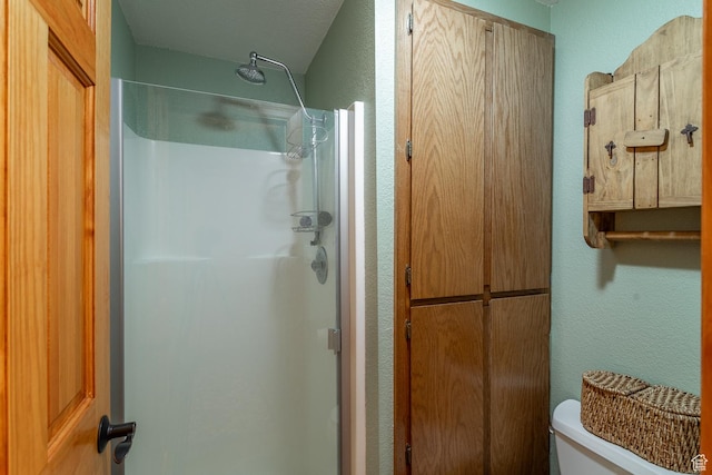 407 S Vasels Rd Unit 65, Brian Head, UT 84719 - bathroom featuring toilet, a textured ceiling, and walk in shower