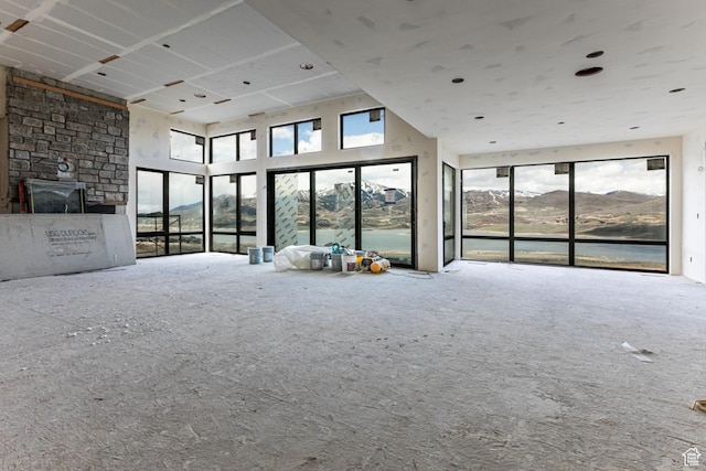 688 E Longview Dr, Hideout, UT 84036 - unfurnished living room with a wealth of natural light, carpet floors, and a high ceiling