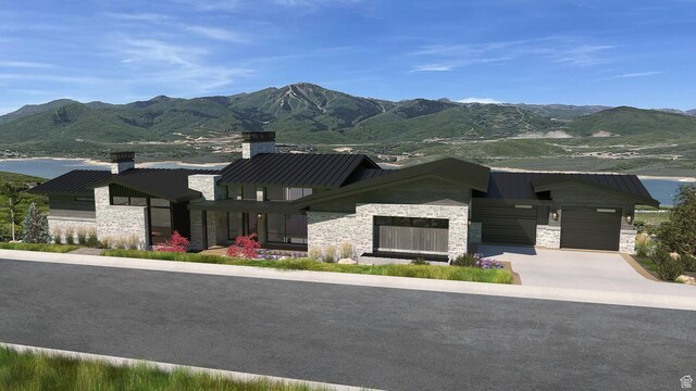 view of front of property featuring a mountain view and a garage