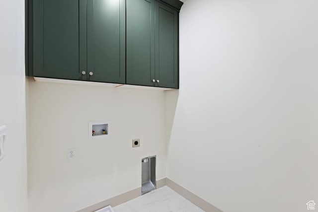 11423 S Watercourse Rd, South Jordan, UT 84009 - washroom featuring cabinet space, electric dryer hookup, washer hookup, marble look tile flooring, and baseboards