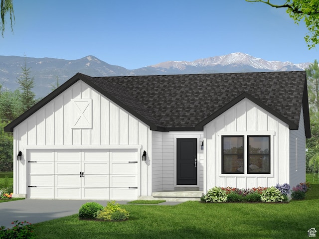 modern inspired farmhouse with a front yard and a mountain view