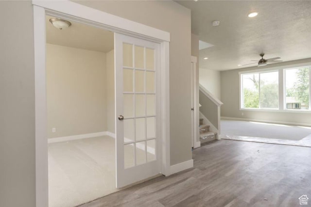 unfurnished room featuring hardwood / wood-style flooring and ceiling fan