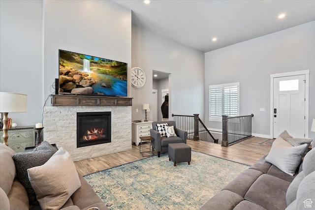 3851 N 425 E, North Ogden, UT 84414 - living room featuring wood-type flooring, a fireplace, and a high ceiling