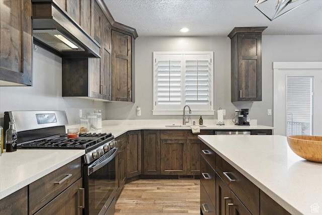 3851 N 425 E, North Ogden, UT 84414 - kitchen with sink, range hood, light hardwood / wood-style floors, a textured ceiling, and appliances with stainless steel finishes