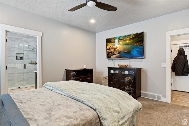 3851 N 425 E, North Ogden, UT 84414 - carpeted bedroom featuring ceiling fan, a textured ceiling, and ensuite bath