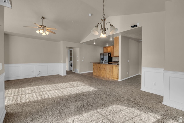 67 S 930 E, American Fork, UT 84003 - unfurnished living room with dark colored carpet, ceiling fan with notable chandelier, washer / dryer, and vaulted ceiling