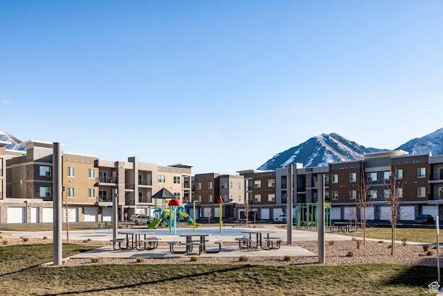 view of community featuring a residential view, a mountain view, and playground community