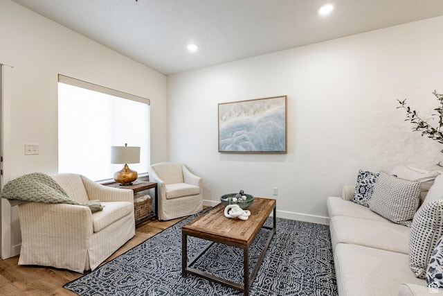 living room with recessed lighting, wood finished floors, and baseboards