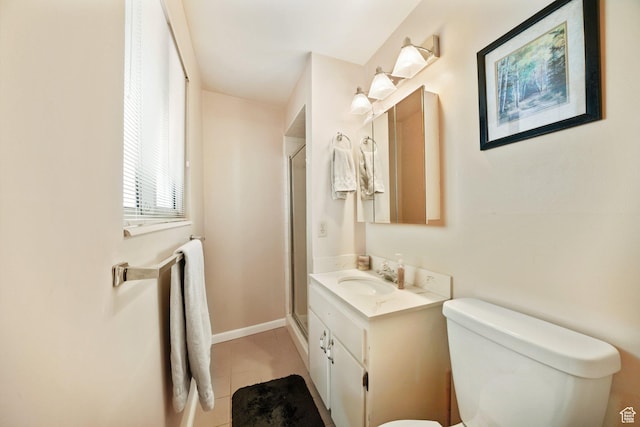 full bathroom featuring a shower stall, tile patterned flooring, toilet, vanity, and baseboards
