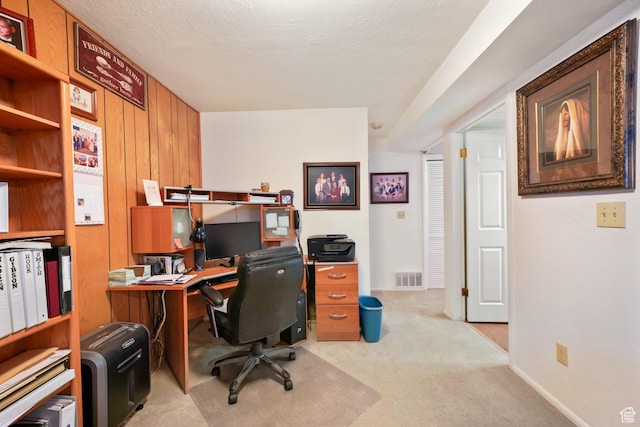 office area featuring carpet flooring and visible vents