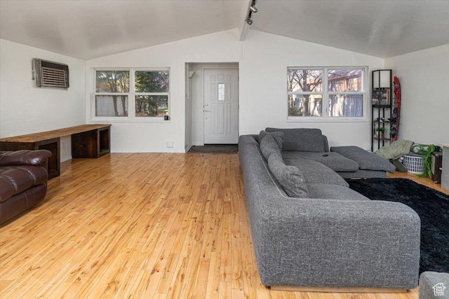 138 Crockett Ave, Logan, UT 84321 - living room featuring vaulted ceiling, hardwood / wood-style floors, and a wall mounted AC