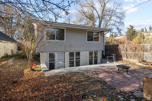 138 Crockett Ave, Logan, UT 84321 - back of house featuring a patio area and an outdoor fire pit