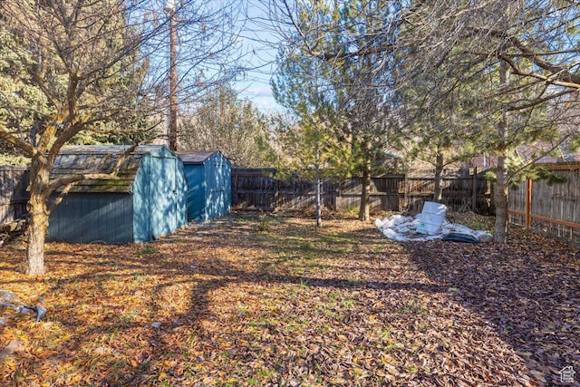 138 Crockett Ave, Logan, UT 84321 - fenced backyard featuring a storage shed