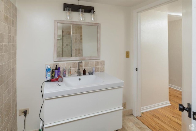 138 Crockett Ave, Logan, UT 84321 - full bathroom with vanity and wood finished floors