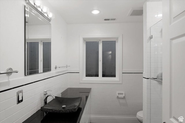 1375 E 260 N, Logan, UT 84321 - bathroom featuring sink, toilet, and tile walls