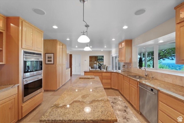 1375 E 260 N, Logan, UT 84321 - kitchen with decorative light fixtures, light brown cabinets, stainless steel appliances, and sink