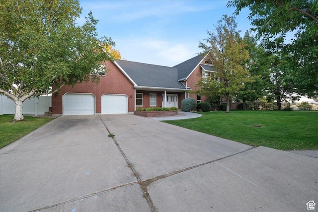 1375 E 260 N, Logan, UT 84321 - view of front of home with a front lawn and a garage