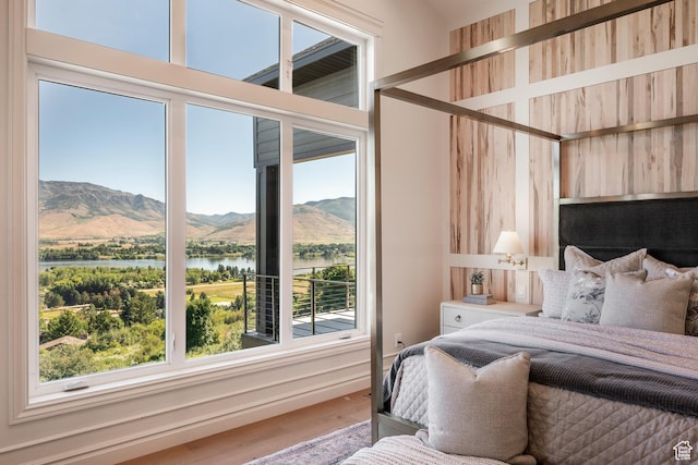 6736 E Via Cortina, Huntsville, UT 84317 - bedroom featuring hardwood / wood-style flooring and a water and mountain view