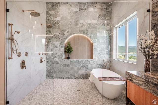 6736 E Via Cortina, Huntsville, UT 84317 - bathroom featuring tile walls and independent shower and bath