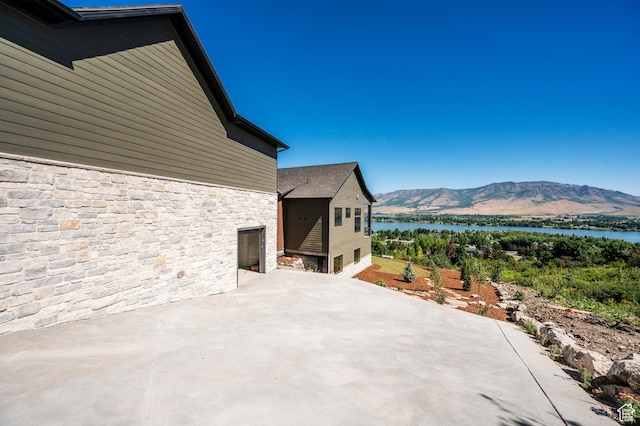 6736 E Via Cortina, Huntsville, UT 84317 - view of patio / terrace featuring a water and mountain view