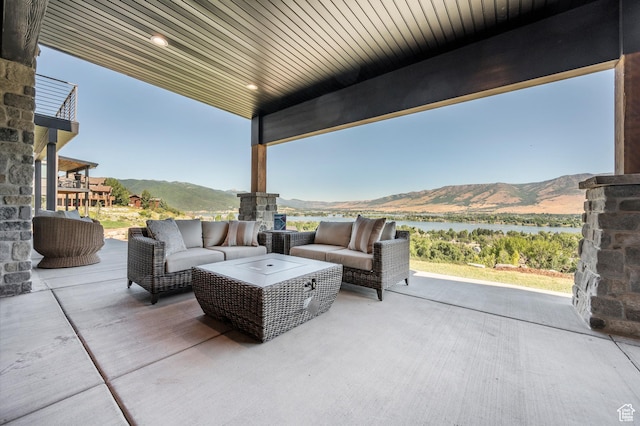6736 E Via Cortina, Huntsville, UT 84317 - view of patio with an outdoor living space and a water and mountain view
