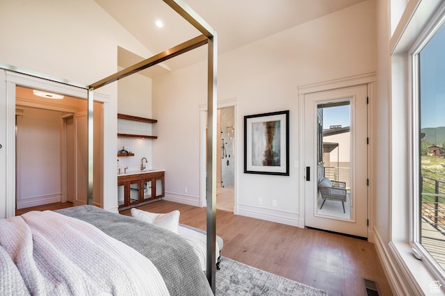 6736 E Via Cortina, Huntsville, UT 84317 - bedroom with access to exterior, hardwood / wood-style floors, and high vaulted ceiling