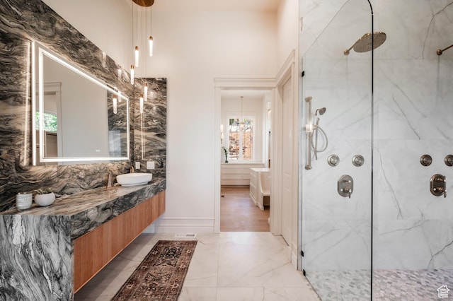 6736 E Via Cortina, Huntsville, UT 84317 - bathroom featuring vanity, a tile shower, and a wealth of natural light