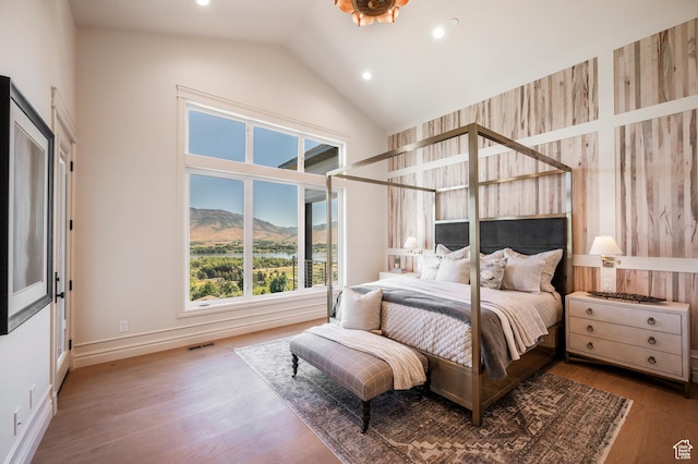 6736 E Via Cortina, Huntsville, UT 84317 - bedroom featuring hardwood / wood-style flooring, a mountain view, and lofted ceiling
