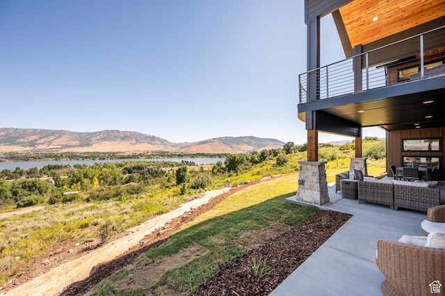 6736 E Via Cortina, Huntsville, UT 84317 - view of yard featuring outdoor lounge area, a balcony, a patio area, and a water and mountain view