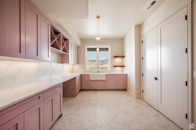 6736 E Via Cortina, Huntsville, UT 84317 - kitchen featuring backsplash, hanging light fixtures, and sink