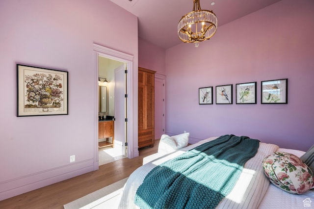 6736 E Via Cortina, Huntsville, UT 84317 - bedroom featuring a chandelier, light hardwood / wood-style floors, and ensuite bathroom