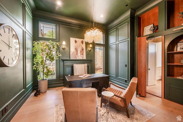 6736 E Via Cortina, Huntsville, UT 84317 - living area with built in shelves, light hardwood / wood-style floors, crown molding, and a chandelier