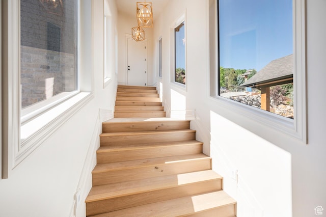 6736 E Via Cortina, Huntsville, UT 84317 - stairs with a chandelier