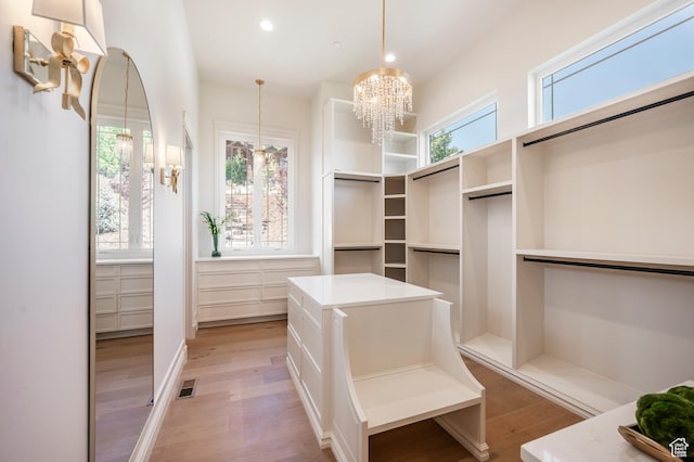 6736 E Via Cortina, Huntsville, UT 84317 - walk in closet with a chandelier and light wood-type flooring