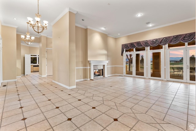 unfurnished living room featuring a notable chandelier, crown molding, light tile patterned floors, and a fireplace